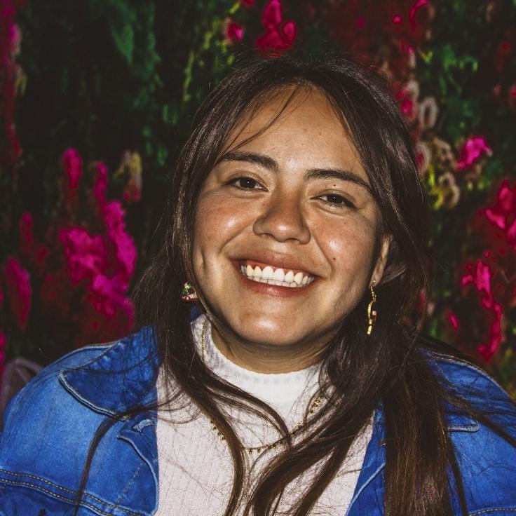 Kaveri Mehta, Lead Design Curator at CalmFieldStudio, reviewing corporate floral arrangements